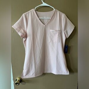 Jaanuu women’s scrub top. Never worn with tags. Pink size S